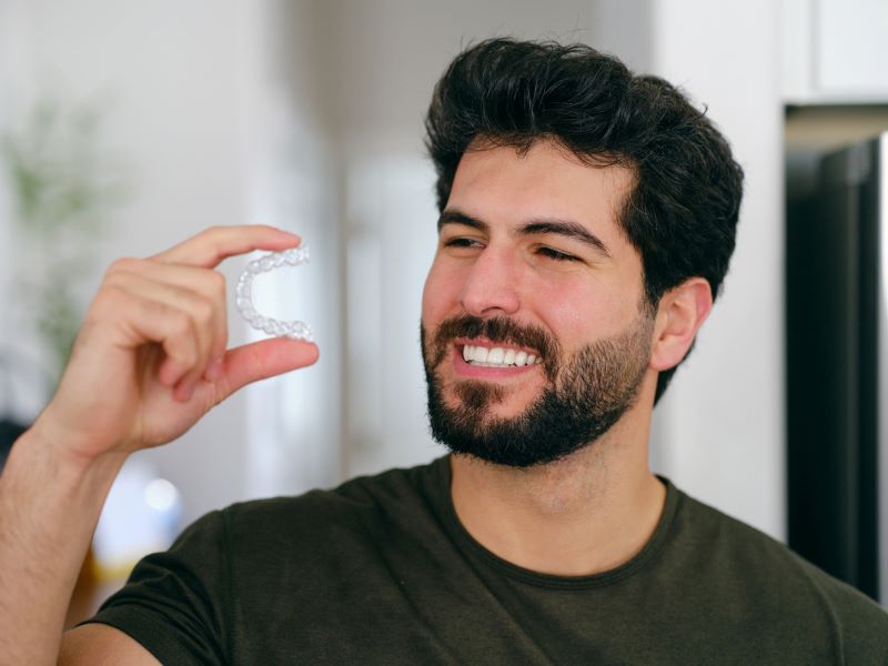 Adult smiling after Invisalign® in Wetherill Park treatment