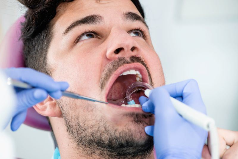 Dentist performing gum disease treatment in Wetherill Park