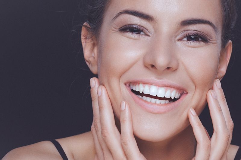 Woman smiling with healthy gums after gum disease treatment in Wetherill Park