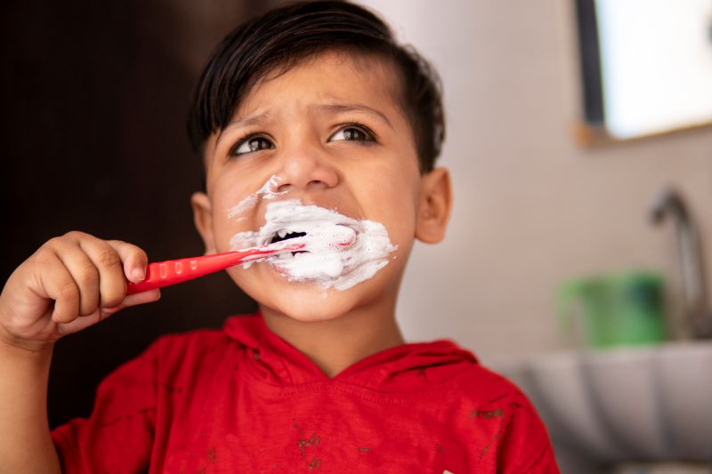 Young child brushing teeth with toothpaste – Children’s Dentistry Wetherill Park