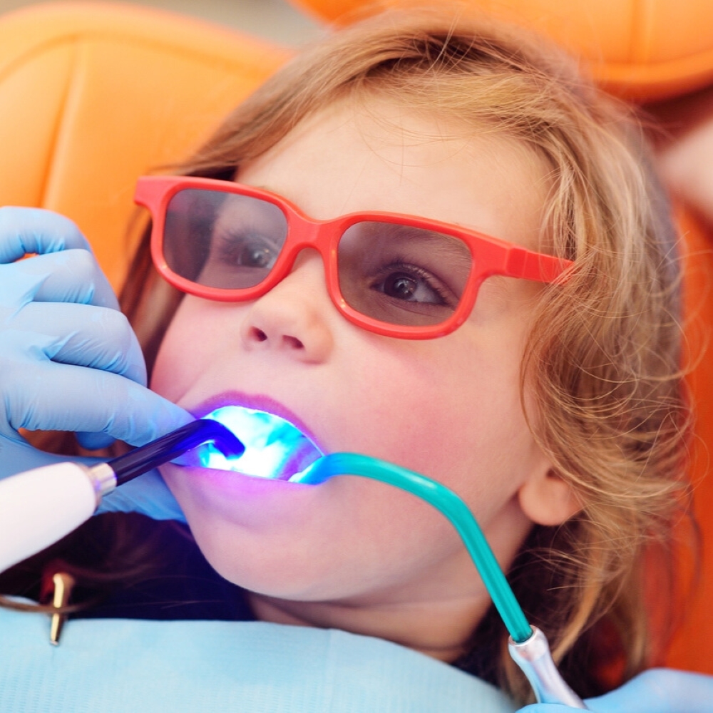 service-children-filling-dentist-wetherill-park Child receiving tooth-coloured dental filling in Wetherill Park.