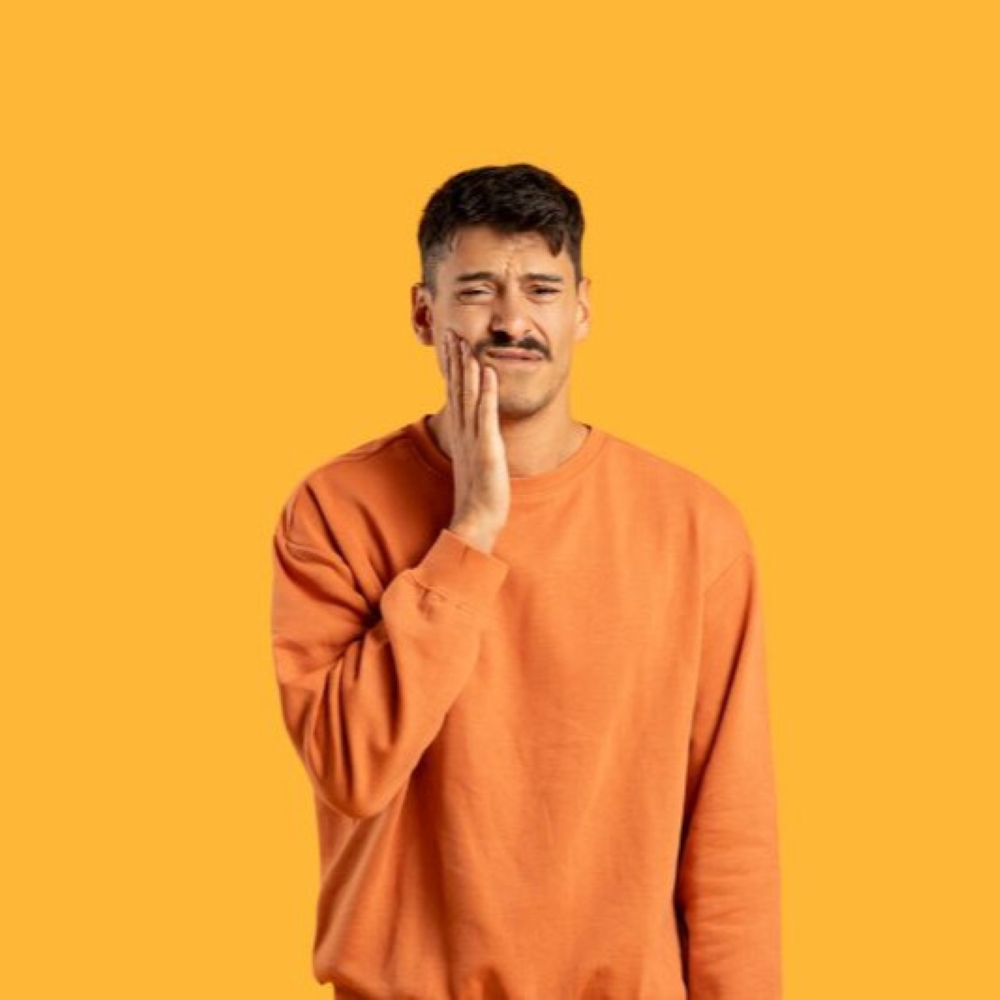 Man with tooth sensitivity holding his cheek in discomfort – Wetherill Park dentist.