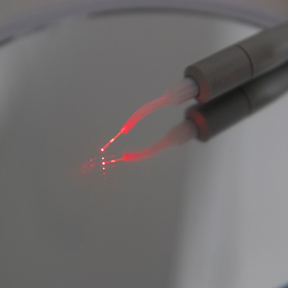 service-laser-gum-therapy-dentist-wetherill-park Dental laser tool emitting red light for precision gum therapy.