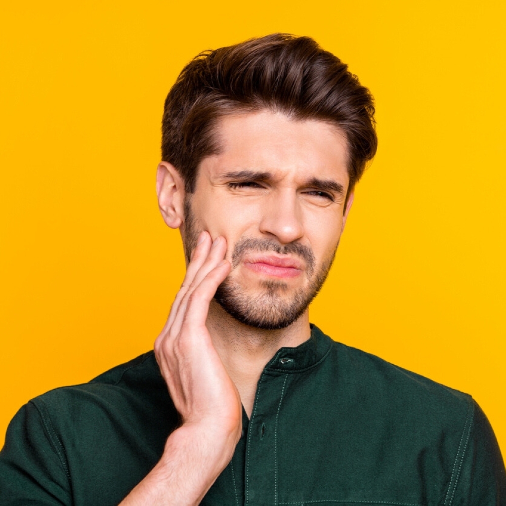 service-tmj-grinding-treatment-dentist-wetherill-park Man with jaw pain needing TMJ consultation in Wetherill Park.