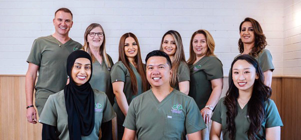 Team of dentists and support staff at Dr Raymond Platon & Associates.