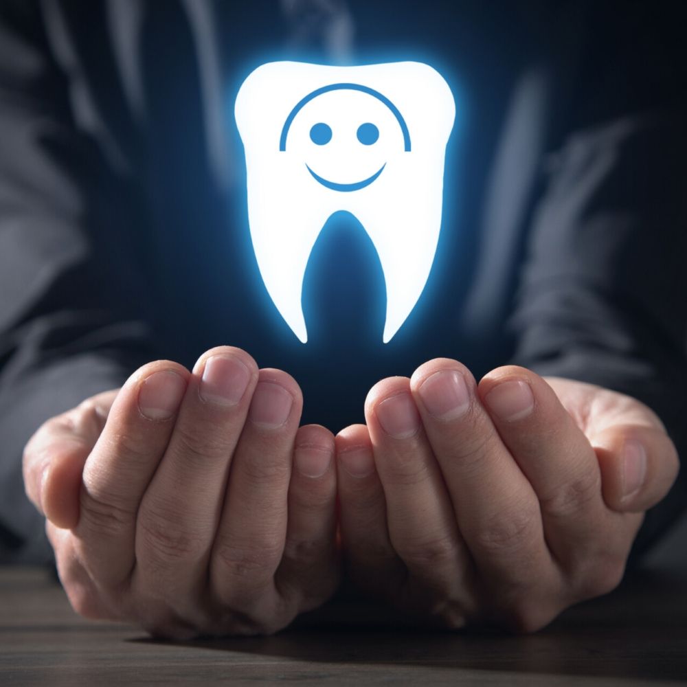 Hands holding a glowing tooth symbol representing dental health fund protection in Wetherill Park.