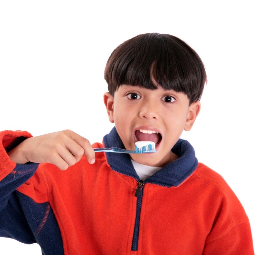 Child brushing teeth with toothpaste – CDBS bulk billing Wetherill Park.