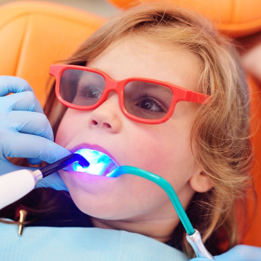 Child receiving tooth-coloured dental filling in Wetherill Park.