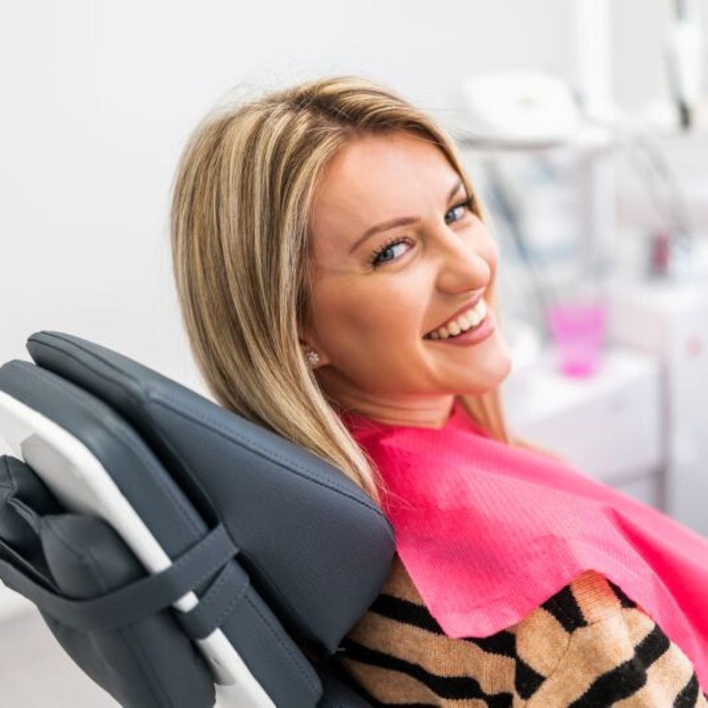 Smiling patient receiving dental cleaning in Wetherill Park at Dr Raymond Platon & Associates.