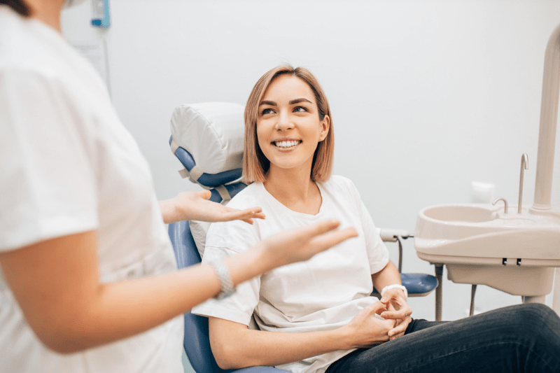 Patient discussing teeth shifting with dentist in Wetherill Park during consultation