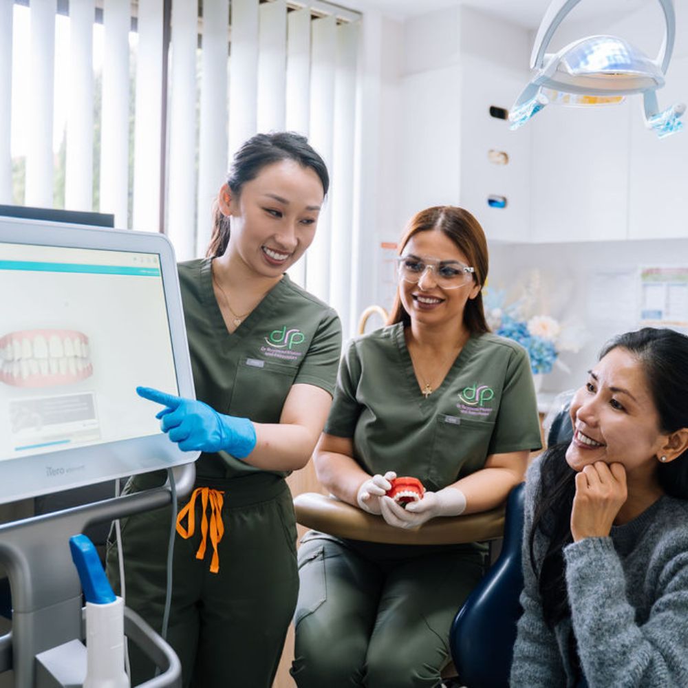 Patient discussing teeth whitening options with oral health therapist in Wetherill Park