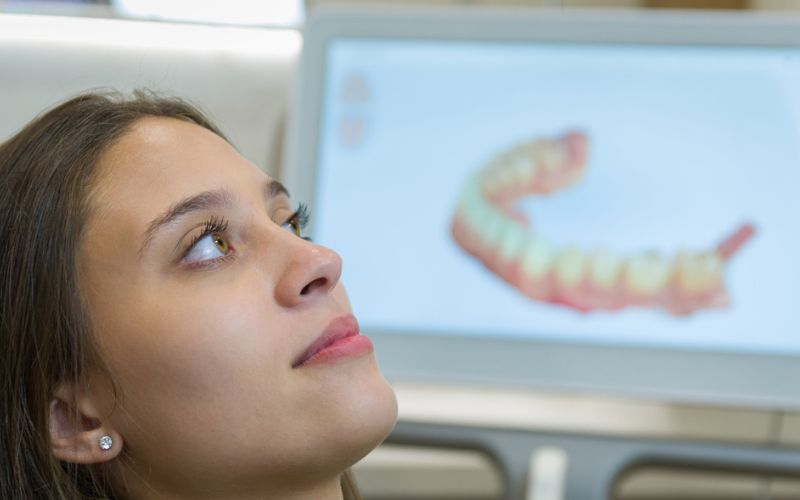 Patient viewing a digital dental scan during a cosmetic dental assessment in Wetherill Park