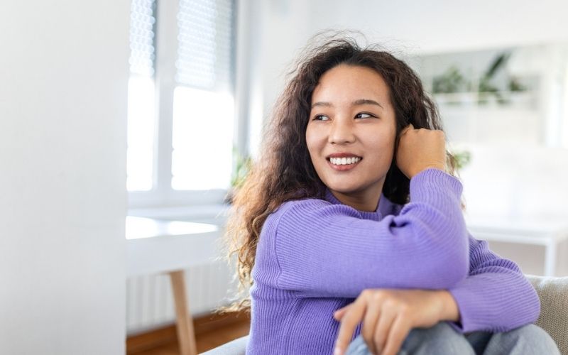 Woman smiling naturally showing her front teeth