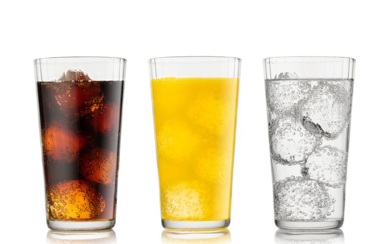 Soft drink, fruit juice and sparkling drink illustrating common acidic beverages